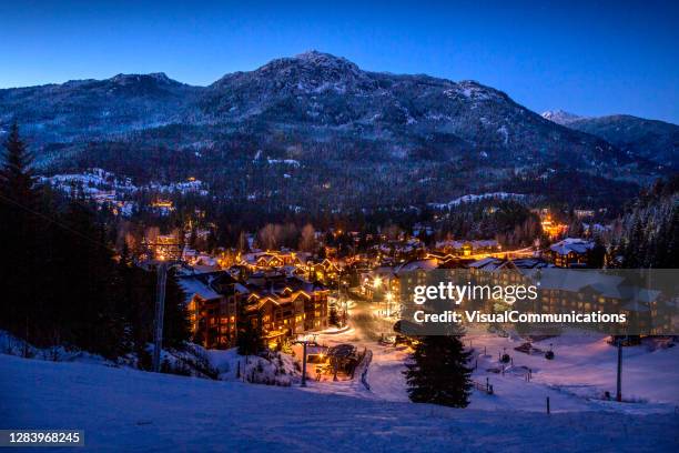 scenic of whistler creekside village in winter. - whistler village stock pictures, royalty-free photos & images