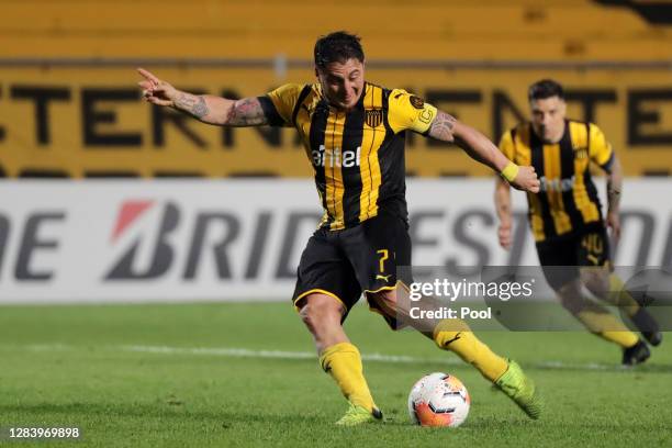 Cristian Rodríguez of Peñaroltakes a penalty kick to score the first goal of his team during a second leg match of the second round of Copa CONMEBOL...