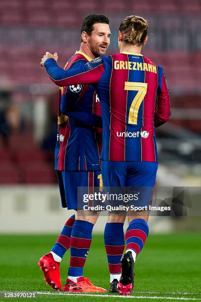 Lionel Messi and Antoine Griezmann of FC Barcelona celebrating their team's first goal during the UEFA Champions League Group G stage match between...