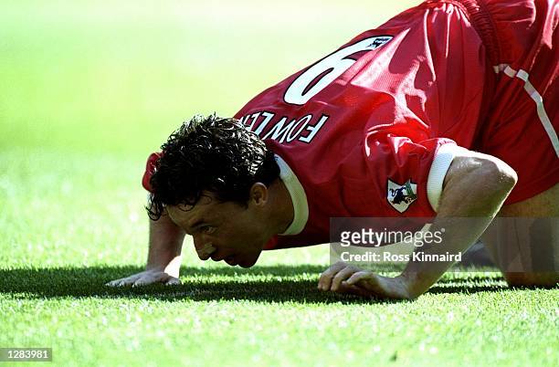 Robbie Fowler of Liverpool mimicks cocaine snorting to celebrate his first goal against Everton in the FA Carling Premiership match at Anfield in...
