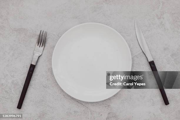 empty table setting with ceramic white plate - empty bowls stock pictures, royalty-free photos & images