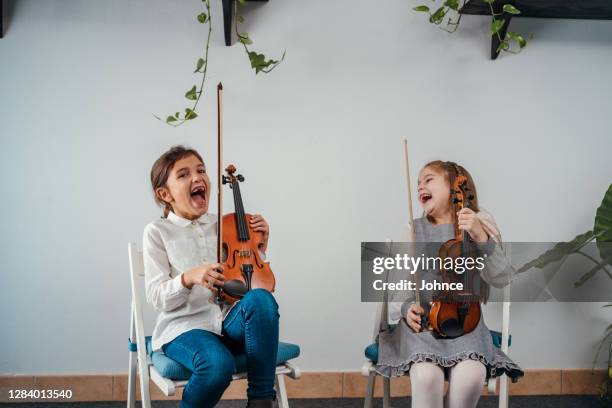 portrait of little girls violinists - string instrument stock pictures, royalty-free photos & images