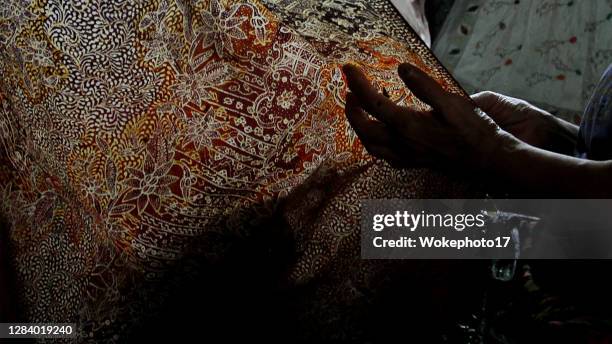 batik maker - batik pattern stock pictures, royalty-free photos & images