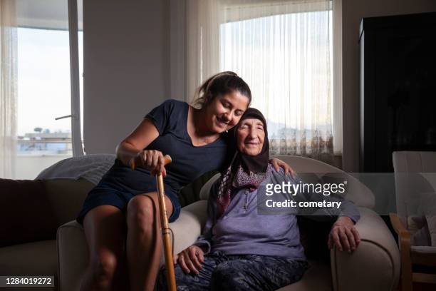 happy portrait of grandchild and grandmother - grandma cane stock pictures, royalty-free photos & images