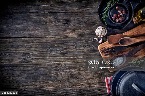 top view of kitchen utensils on rustic table with copy space. - cutting board stock pictures, royalty-free photos & images