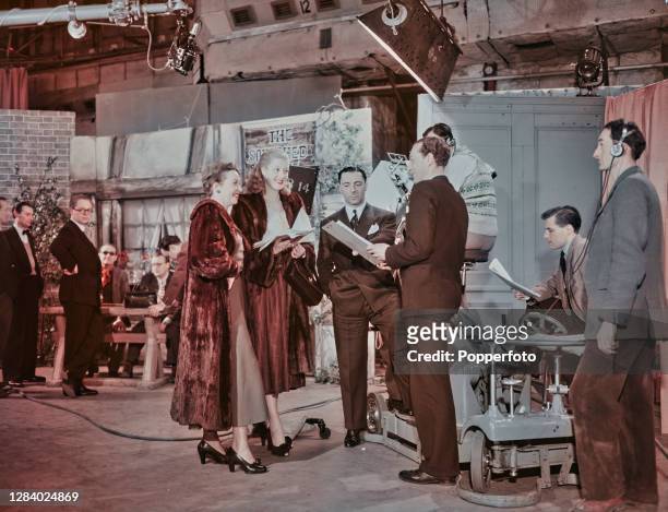 British television executive Ronnie Waldman , Head of Light Entertainment at the BBC, stands 4th from right with actresses Rosalyn Boulter and...