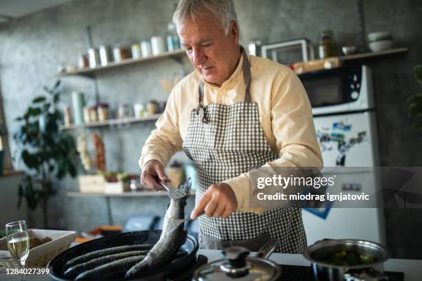 Man Frying Fish Man Frying Fish Photos and Premium High Res Pictures - Getty Images