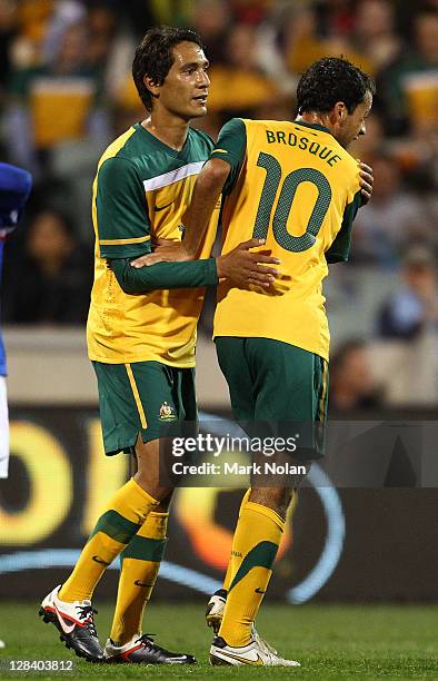 Alex Brosque of Australia is congratulated by Adam Sarota after scoring during the International Friendly match between the Australian Socceroos and...