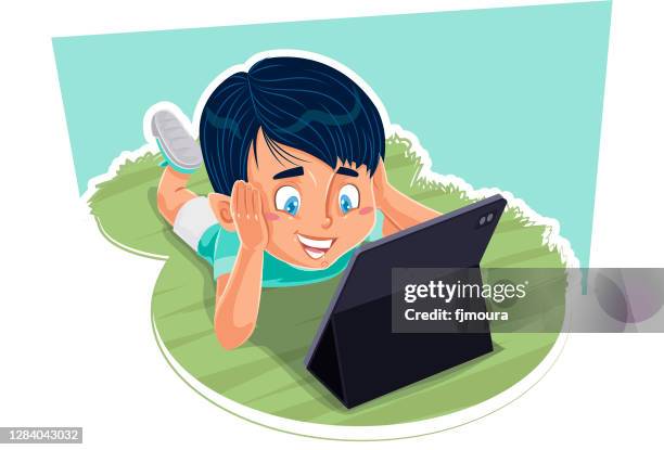 child reading and studying with book, notebook or tablet - children playing video games on sofa stock illustrations