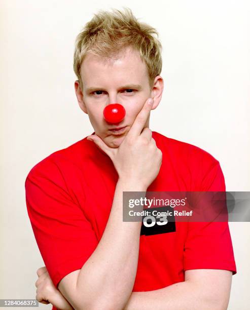 Presenter, Patrick Kielty posing in a Red Nose Day T-Shirt and nose for Red Nose Day 2003, in the studio on 14 March, 2003 in London.