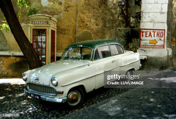 old timer opel automobile in portugese village. - opel stock pictures, royalty-free photos & images