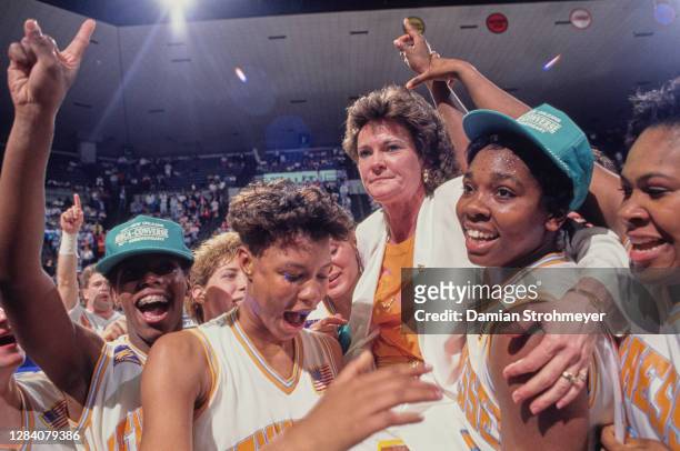 Pat Summitt, Head Coach for the Tennessee Lady Volunteers celebrates with the team after winning the NCAA Division I Women's Basketball Tournament...