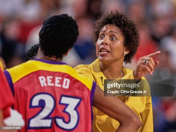 Cheryl Miller, Head Coach for the Phoenix Mercury gives instructions to Forward#23 Brandy Reed during the WNBA Western Conference basketball game...