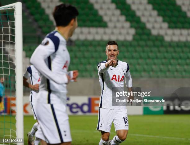 Giovani Lo Celso of Tottenham Hotspur celebrates with Son Heung-Min of Tottenham Hotspur after he scores his sides third goal during the UEFA Europa...