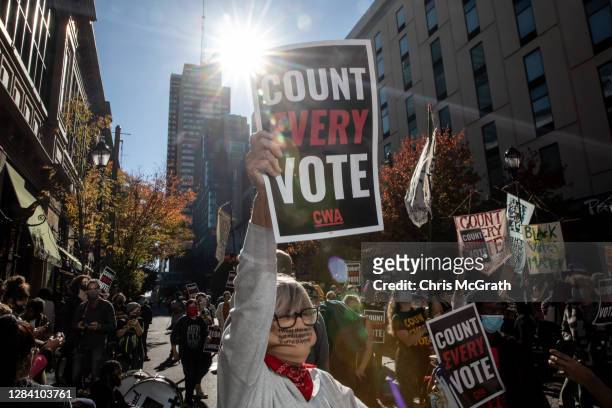 Woman participates in a protest in support of counting all votes as the election in Pennsylvania is still remains too close to call on November 5,...
