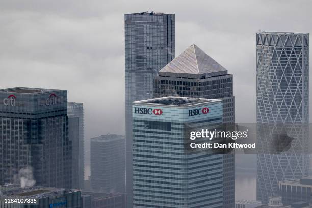 Fog shrouds the Canary Wharf business district including global financial institutions Citigroup Inc., State Street Corp., Barclays Plc, HSBC...