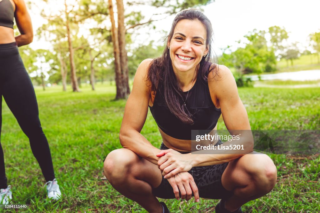 Woman in workout clothes looks at the camera in a candid relaxed portrait
