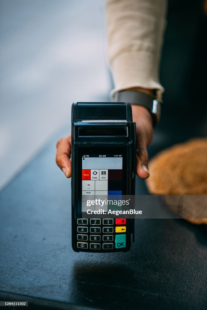 Waiter Holding Pos Device For Contactless Payment