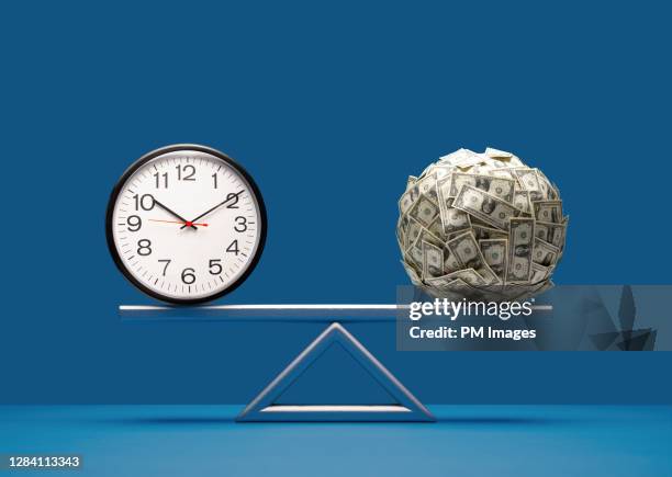 balancing time and money - scales balance fotografías e imágenes de stock