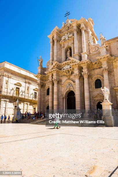 Duomo di Siracusa in Piazza Duomo, tourists sightseeing at The Temple of Athena, Syracuse Cathedral, Ortigia, Syracuse, Siracusa, UNESCO World...