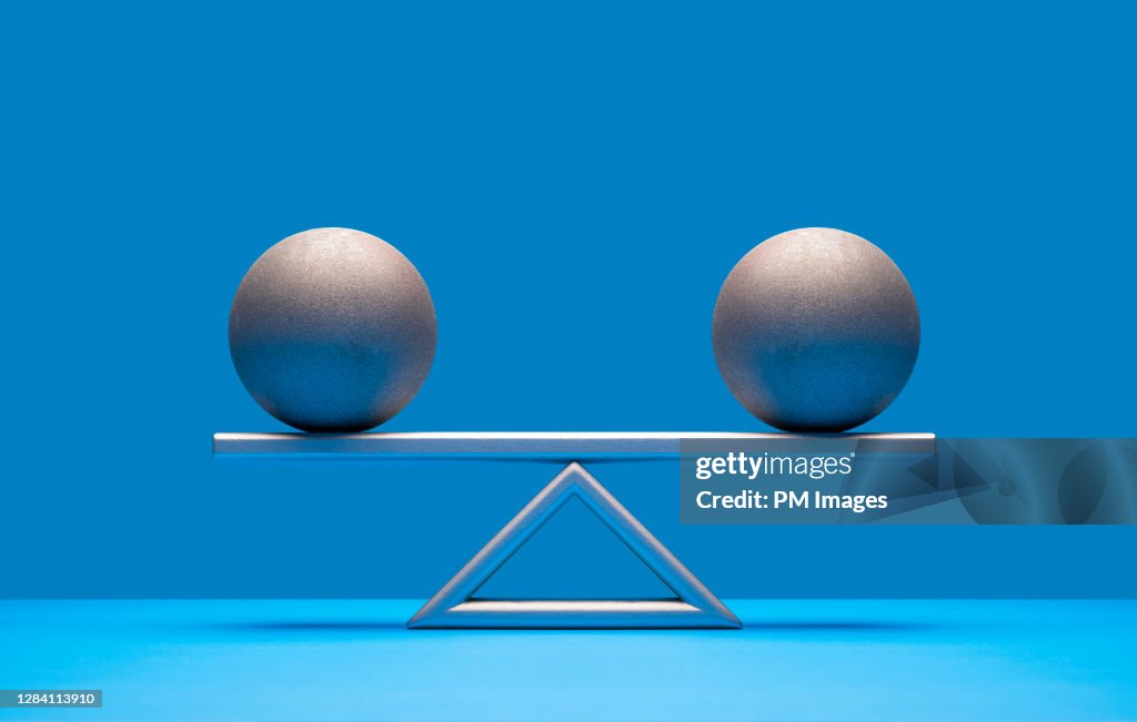Balls balancing on scale