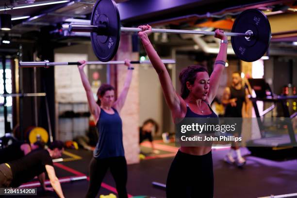 Participants take part in a Kobox workout at KOBOX Chelsea on October 22, 2020 in London, England. KOBOX offers 50-minute combination workouts which...