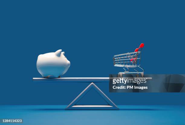 balancing savings and spending - scales balance stock pictures, royalty-free photos & images