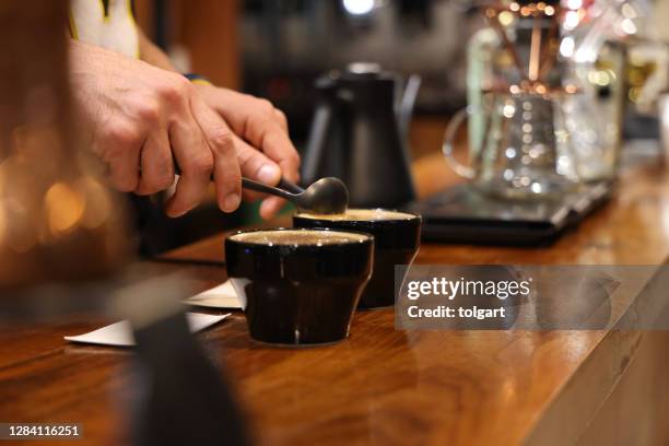 barista preparing to test and inspecting the quality of coffee - mão em forma de concha imagens e fotografias de stock