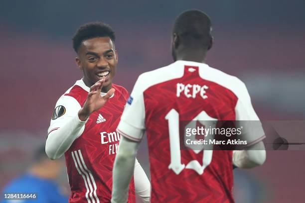Joe Willock and Nicolas Pepe of Arsenal celebrate following their team's second goal, an own goal by Sheriff Sinyan of Molde FK during the UEFA...