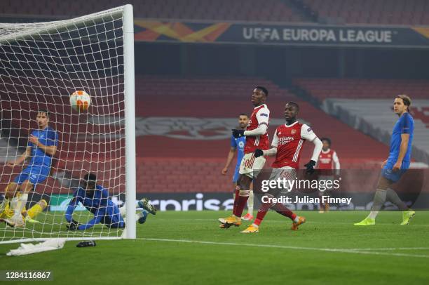 Eddie Nketiah of Arsenal and Nicolas Pepe of Arsenal look on as Sheriff Sinyan of Molde scores an own goal giving arsenal their second goal during...
