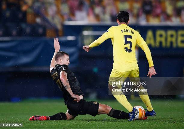 Dani Parejo of Villarreal CF competes for the ball with Eden Karzev of Maccabi Tel-Aviv FC during the UEFA Europa League Group I stage match between...