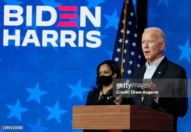 Democratic presidential nominee Joe Biden speaks while flanked by vice presidential nominee, Sen. Kamala Harris , at The Queen theater on November...