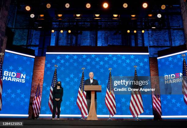 Democratic presidential nominee Joe Biden speaks while flanked by vice presidential nominee, Sen. Kamala Harris , at The Queen theater on November...