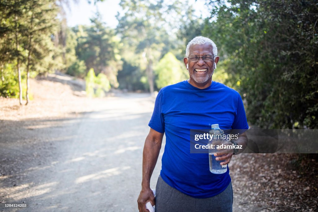 Senior African American Man Drinking Water
