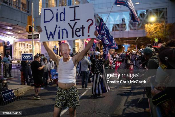 Supporters of U.S. President Donald Trump hold signs and chant slogans during a protest outside the Philadelphia Convention Center as votes continue...