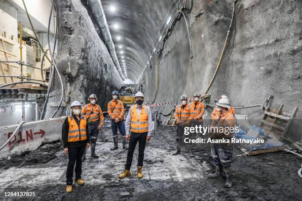 Minister for Transport Infrastructure and Minister for Suburban Rail Loop Jacinta Allan and Premier of Victoria Daniel Andrews with workers pose for...