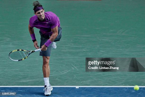 Rafael Nadal of Spain serves in his quarter final match against Santiago Giraldo of Colombia during day five of the Rakuten Open at Ariake Colosseum...