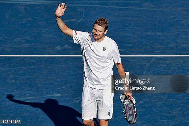Mardy Fish of the United States celebrates after winning his quarter final match against Bernard Tomic of Australia during day five of the Rakuten...