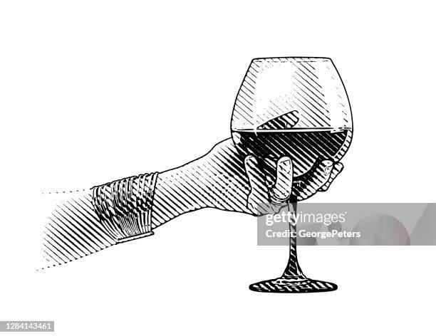 close-up of hand holding glass of wine - wine glass white background stock illustrations