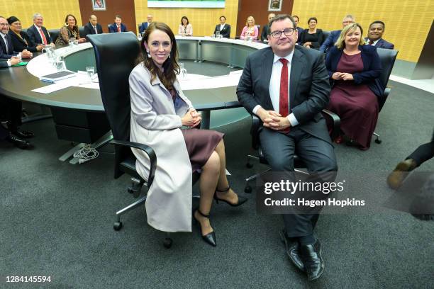 Prime Minister Jacinda Ardern and Deputy Prime Minister Grant Robertson look on during the first cabinet meeting since the election at Parliament on...