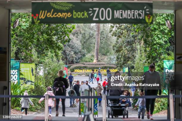 Families are seen at the entrance of the Melbourne Zoo on November 06, 2020 in Melbourne, Australia. Lockdown restrictions in Melbourne were lifted...