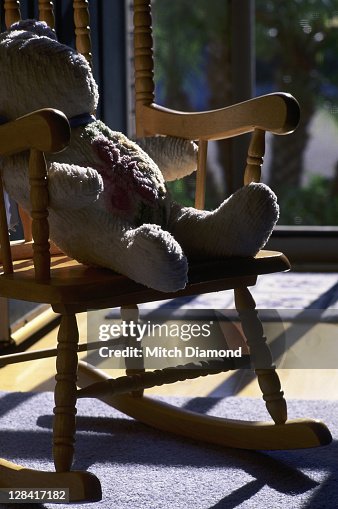 bear doll in rocking chair