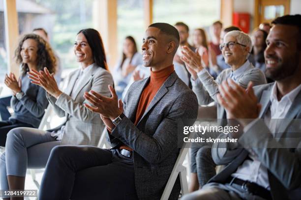applauding on a business seminar! - business conference stock pictures, royalty-free photos & images