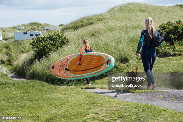 let's go paddleboarding! - paddleboarding team stock pictures, royalty-free photos & images