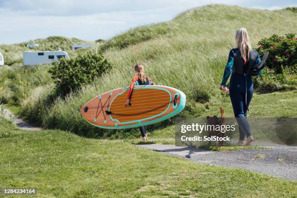 let's go paddleboarding! - mature paddleboard stock pictures, royalty-free photos & images