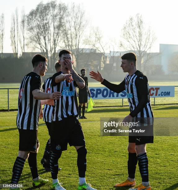 Stan Flaherty of Newcastle United celebrates with teammate Elliot Anderson after scoring the winning goal during the Premier League 2 match between...