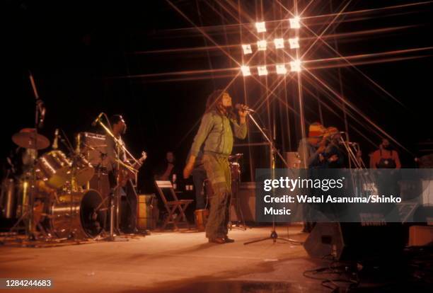 Bob Marley performing on stage with The Wailers at the West Coast Rock Show, Ninian Park in Cardiff, Wales, 19th June 1976. L-R Carlton Barrett ,...