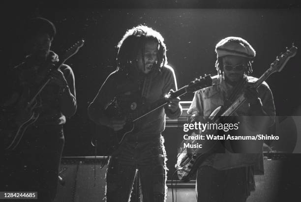 Bob Marley performing on stage with The Wailers at the West Coast Rock Show, Ninian Park in Cardiff, Wales, 19th June 1976. L-R Earl "Chinna" Smith ,...