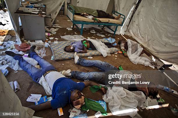 The bodies of five recently killed pro-Gaddafi loyalists lie in an abandoned medical encampment near the south entrance of the Bab al-Aziziya...