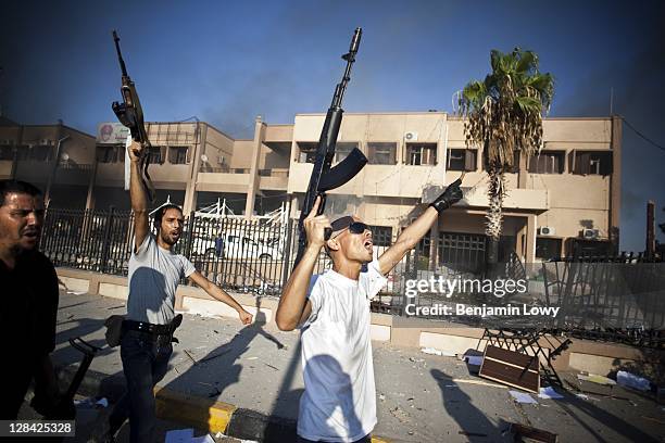 Libyan rebels celebrate their victory over Gaddafi loyalist fighters in the Abu Salim neighborhood on August 25 2011 in Tripoli, Libya.